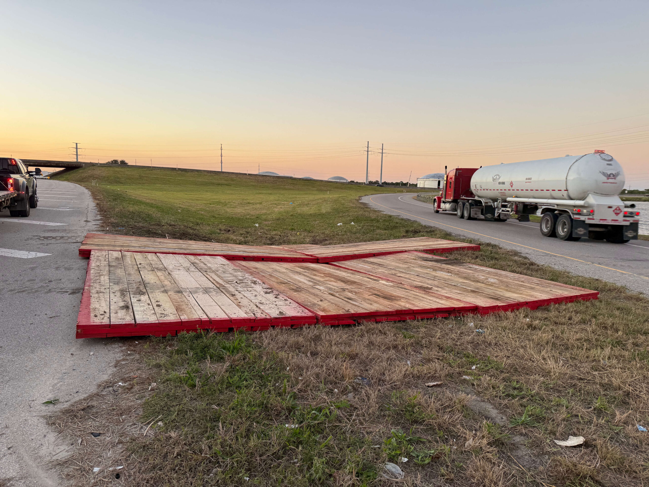 3ply laminated mats placed on grass in between roads.